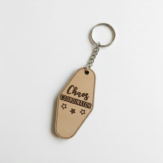 Chaos Coordinator keychain with metal ring and chain on white background